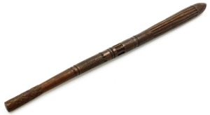A late 19thC carved ethnographic war club, with hatched and fluted carving, 76cm wide.