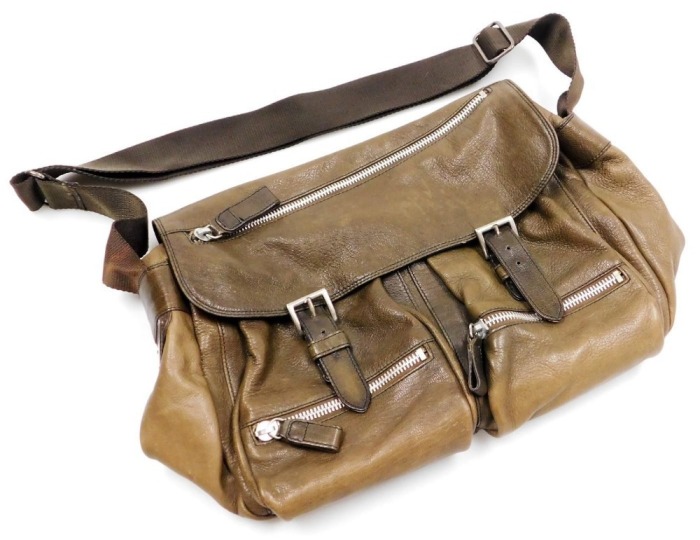 A Prada brown leather shoulder bag, with zipped and open front compartments, bears plaque, 45cm wide.