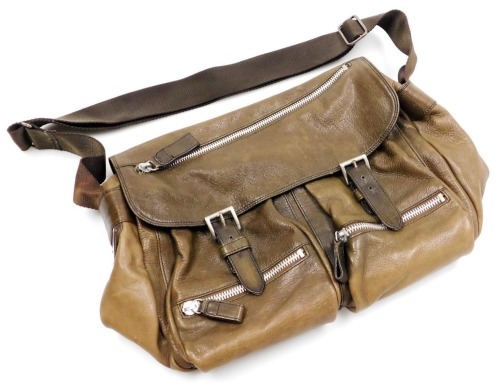A Prada brown leather shoulder bag, with zipped and open front compartments, bears plaque, 45cm wide.