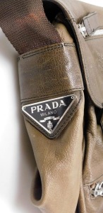 A Prada brown leather shoulder bag, with zipped and open front compartments, bears plaque, 45cm wide. - 2
