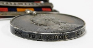 A Boer War Queens South Africa Medal, named to Pte J Seddons, 1st Loyal North Lancashire Regiment M.I., 5086, with clasps for Oramge Free State and Cape Colony, together with a late 19thC photograph of three British soldiers, mounted on camels in Egypt, S - 4