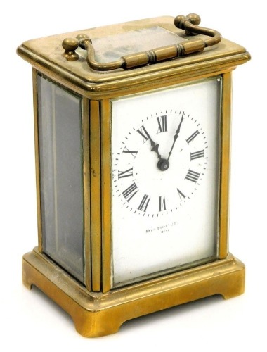 A late 19thC brass cased carriage clock, rectangular enamel dial bearing Roman numerals, single barrel movement, the case of conventional form, with key, 12cm high.