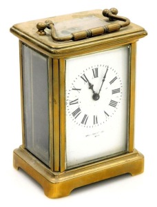 A late 19thC brass cased carriage clock, rectangular enamel dial bearing Roman numerals, single barrel movement, the case of conventional form, with key, 12cm high.