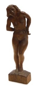A mid century wooden sculpture of a nude woman, her hands bound with a rope around her waist, monogrammed JP, dated '45, 45cm high.