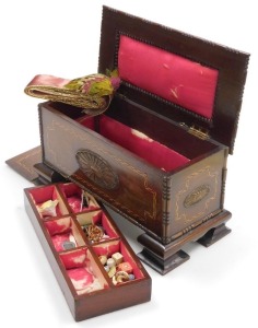 An early 20thC mahogany sewing casket, with carved sunburst paterae, and herringbone inlay, the hinged lid opening to reveal a fitted interior, raised on bracket feet, 20cm high, 33cm wide, 16cm deep. - 2