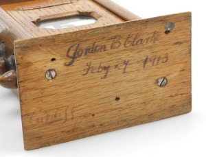 An early 20thC oak cased perpetual desk calendar, 15cm high. - 2