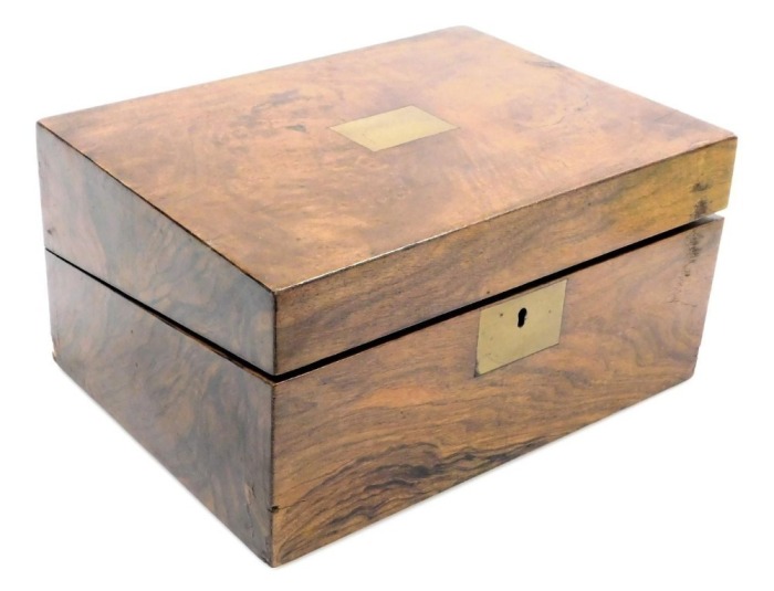 A Victorian walnut writing slope, with brass escutcheon, the hinged lid opening to reveal a slope and fitted interior, 15cm high, 30cm wide, 23cm deep.