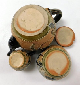 A late 19thC Royal Doulton stoneware three piece tea set, modelled by Alice Ritchin, tube line decorated with flowers and leaves against a chine ground, incised and impressed marks, comprising teapot, cream jug and sugar bowl. - 2