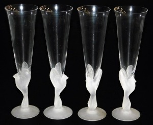 A set of four Sasaki Wings crystal champagne flutes, the clear tapering flute within a frosted glass bird stem, on a conical foot, 24cm high.