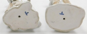 A Lladro porcelain figure of a boy with a kid goat, wrapped around his shoulders, 28cm high, and a further Lladro figure of a girl with a bowl of seeds, feeding a goose, 24cm high. (2) - 2