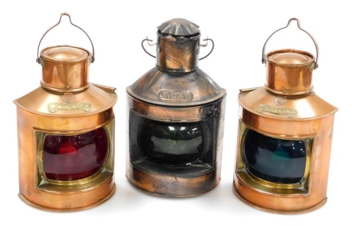 A pair of copper and brass ship's port and starboard lamps, and a further starboard lamp. (3)