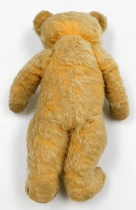 An early 20thC vintage Teddy bear, with a humped back, centre stitched body, jointed arms, legs and head, the snout stitched, eyes lacking, right ear bears a button, 40cm high. - 2