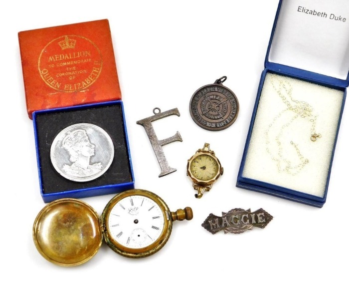 A lady's 9ct gold cased wristwatch, late 19thC hunting cased pocket watch, 9ct gold neck chain, 0.3g, silver F pendant, Victorian brooch named for Maggie, Queen Elizabeth II Coronation commemorative medallion, and a Royal Lifesaving Society medal, named a