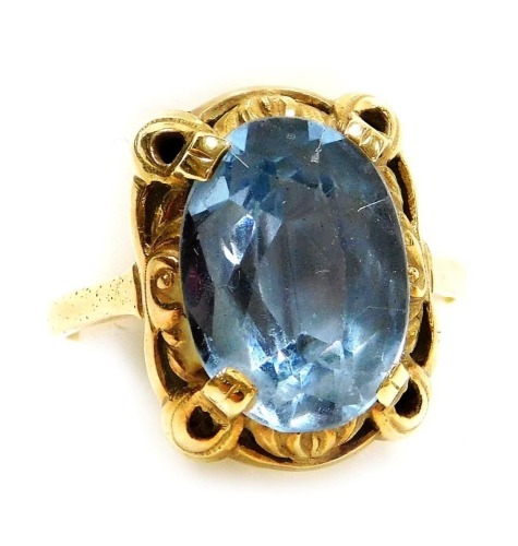 A 14ct gold and aquamarine ring, the oval cut aquamarine in a claw and foliate scroll mount, approx 4.5 carats, size R, 5.4g.