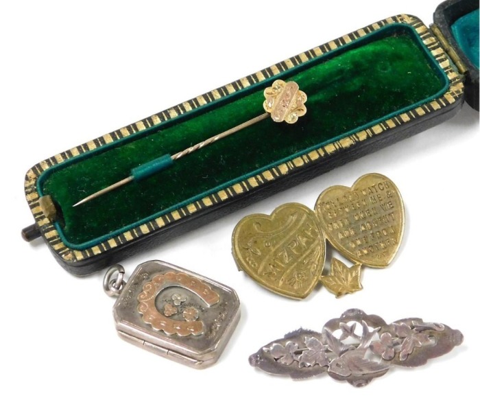 A Victorian 9ct gold tiepin, with engraved decoration, cased, 0.7g, together with a Victorian silver locket pendant, silver brooch pierced and engraved with a swallow and leaves, and a Mizpah brooch. (4)
