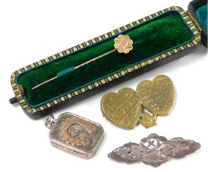 A Victorian 9ct gold tiepin, with engraved decoration, cased, 0.7g, together with a Victorian silver locket pendant, silver brooch pierced and engraved with a swallow and leaves, and a Mizpah brooch. (4)