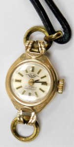 A mid Century Talis 9ct gold cased lady's wristwatch, circular champagne dial, seventeen jewelled movement, on a partial leather strap, together with a Victorian sweetheart brooch, yellow and rose metal, formed as two overlapping hearts, two anchors and a - 2