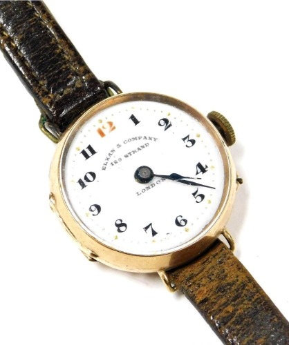 An early 20thC rose gold cased wristwatch, for Elkan & Company, 129 Strand London, circular enamel dial bearing Arabic numerals, Swiss movement, plain case, on a leather strap.