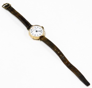 An early 20thC rose gold cased wristwatch, for Elkan & Company, 129 Strand London, circular enamel dial bearing Arabic numerals, Swiss movement, plain case, on a leather strap. - 2