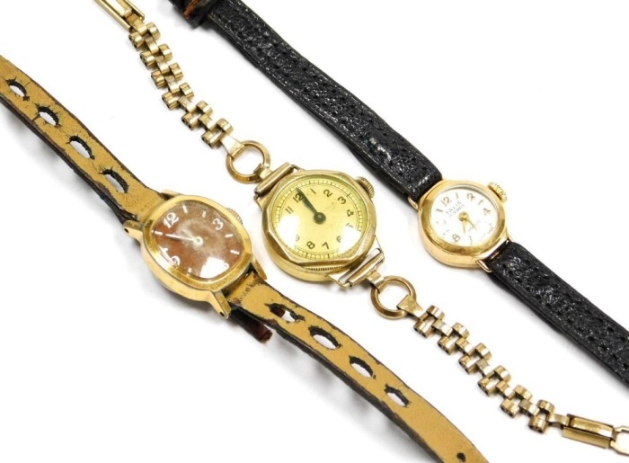 A Talis Incabloc lady's 9ct gold cased wristwatch, circular dial bearing Arabic numerals at evens, seventeen jewelled movement, back presentation engraved, together with two gold plated lady's cased wristwatches. (3)