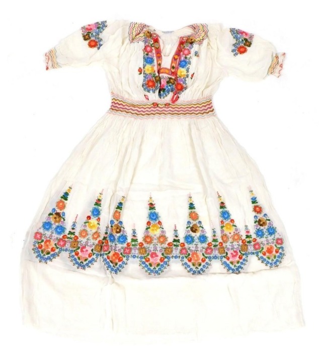 A mid century Hungarian wedding dress, embroidered with flowers, in a box, with provenance to base.