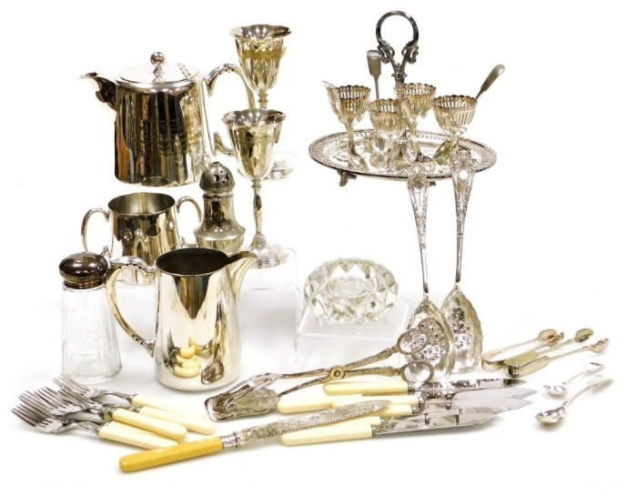 Plated wares, including a three piece tea set, an egg cruet, a pair of goblets, sugar sifters, and flatware. (a quantity)