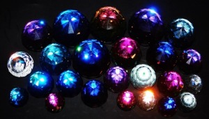 A group of faceted crystal paperweights, plain and various colour ways. (a quantity) - 2