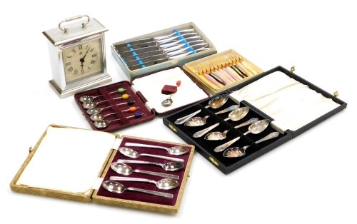 Silver plated and stainless steel flatware, including grapefruit spoons, coffee spoons with bean terminals, teaspoons and cake forks, all boxed, together with a quartz mantel clock. (a quantity)