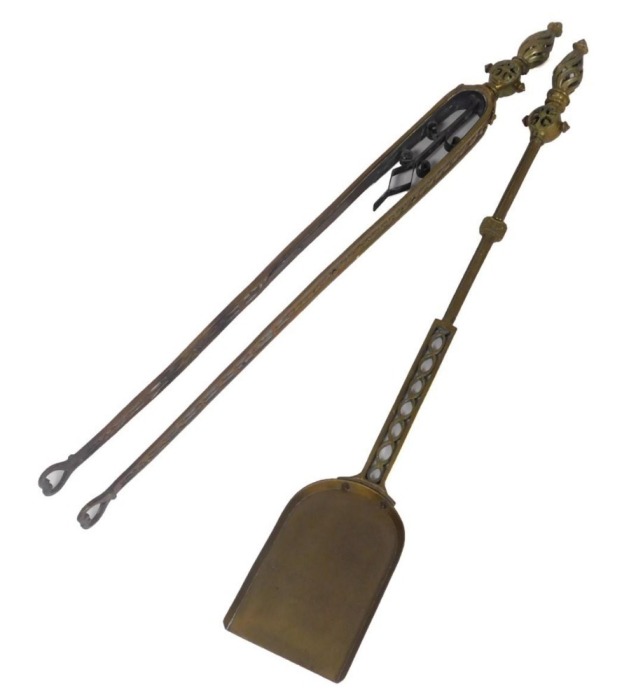 A pair of Victorian brass and copper fireside implements, with pierced decoration, comprising a shovel and pair of tongs, 82cm high.