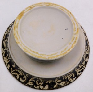 A 20thC brown glazed pedestal bowl, decorated with flowers and leaves within a scroll and foliate border, 39.5cm wide. - 2
