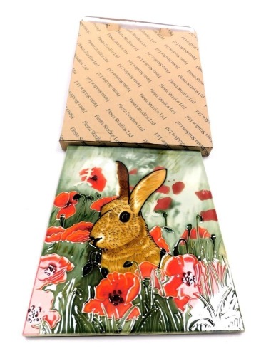 A Fiesta Studios Limited pottery plaque, decorated with a hare in a poppy field, designed by David Feather, boxed, 35cm x 28cm.