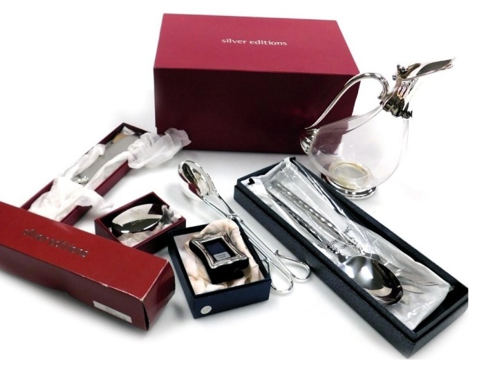A group of silver plate and other metal wares, including a Silver Editions cut glass and plated claret jug, plated paperweight to commemorate the marriage of Prince William of Wales and Miss Catherine Middleton, and jumbo salad tongs, together with a smal