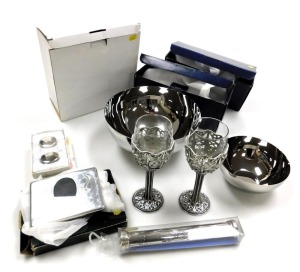 A group of collectables, including a pair of Malaysian Celtic pattern red wine goblets, a birth certificate scroll, and a photograph frame. (7)