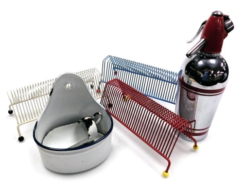 Three 1950's atomic record racks, an enamel ware scoop, wall hanging soap dish with drainer, and a Sparklets Limited soda siphon, model SG2.