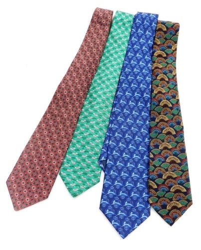 Four silk ties, comprising Hermes zebra pattern, Lanvin decorated with animals, Austin Reed decorated with Oriental fans, and Stefano Ricci decorated with red roundels against a black ground.