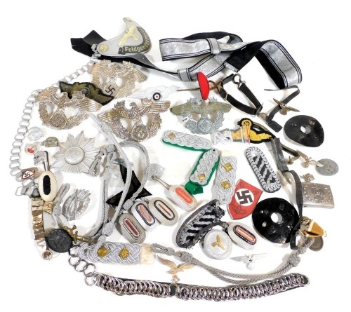A selection of ephemera, cap badges, badges, all after World War II, all German, including SS badge, Luftwaffe, Gestapo, etc.