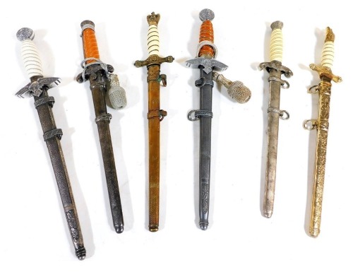 Six reproduction German daggers, including a second pattern Luftwaffe dagger, a Kriegsmarine officer's dagger, and an army officer's dagger.