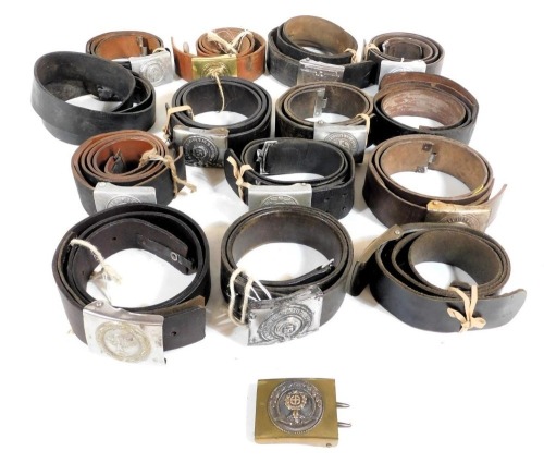 Ten World War II German leather belts, with belt buckles, three other leather belts with later buckles, various associated other leather items, and a Kriegsmarine flag.
