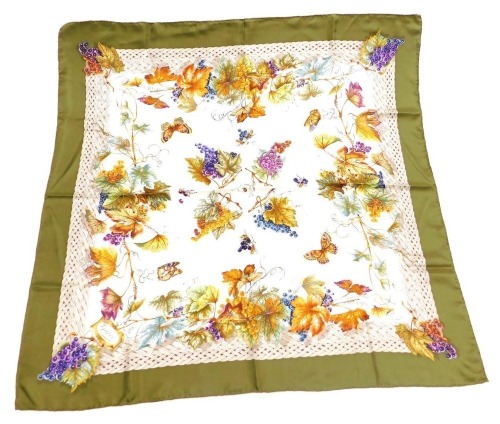 A Gucci silk scarf, decorated with grapes and vines, butterflies and bees within a lattice work and olive green border, 86cm x 86cm.