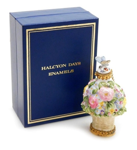 A Halcyon Days porcelain and gilt silver mounted scent bottle, the stopper modelled as a butterfly, the body as a basket of flowers, 7cm high, boxed.
