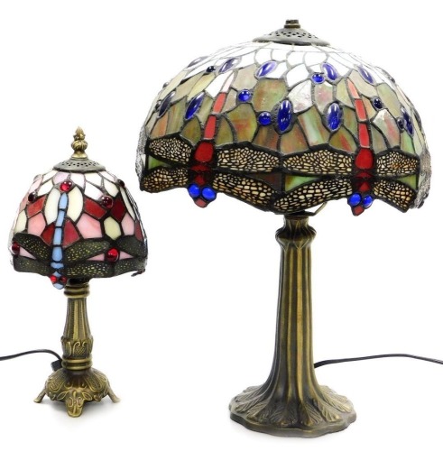A Tiffany style table lamp, with a hexagonal shade decorated with dragonflies, 45cm high, and a smaller Tiffany style table lamp with a similarly decorated shade, 31cm high. (2)