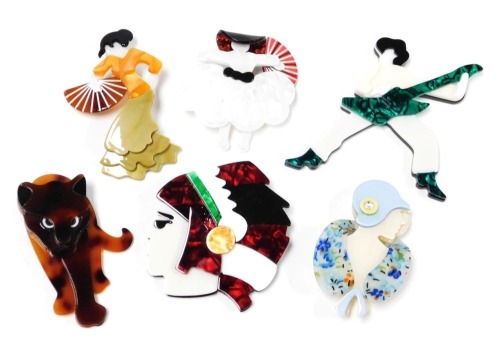A group of Lea Stein style costume jewellery, comprising a guitar playing rock star, Native American Indian's bust profile, Art Deco lady bust profile, flamenco lady, girl with a big hat and fan, and a big cat. (6)