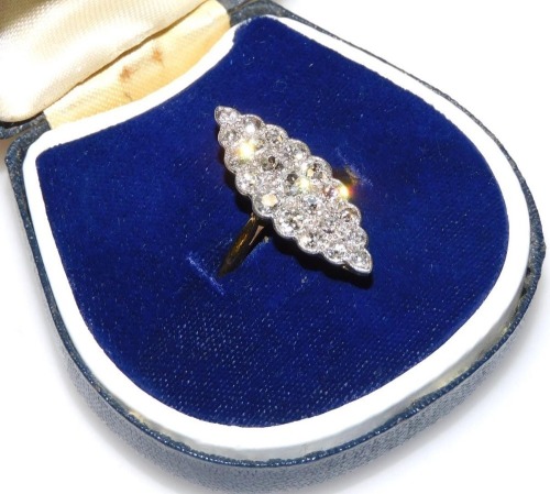 An early 20thC 18ct gold and diamond marquise ring, set with twenty-one graduated rose cut diamonds, the ring measures 2.7cm x 1cm, size P, total weight 4.42g.