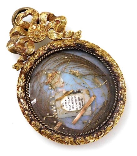 A Georgian hair locket memorial, decorated with a classical urn and plaque, 'No Time Thy Dear Remembrance Can Remove', in a gilt frame, 4cm wide.