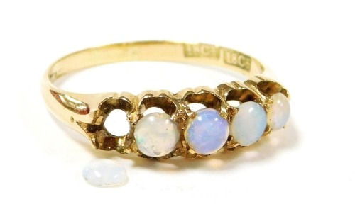 An 18ct gold and opal five stone ring, in a claw mount, size M, 2.5g. (AF)