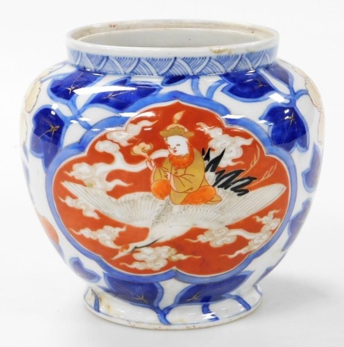 A Meiji period Japanese porcelain Fukagawa jar, decorated with two reserves depicting a figure seated on a flying stork, the background decorated with flowers, with gilt highlights, blue three character mark, 15cm high.