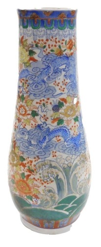A modern Chinese porcelain vase, of tapered ovoid design, decorated in under glaze blue with dragons, flower heads and foliage, in iron red and green, red six figure character mark to the base, 53cm high.