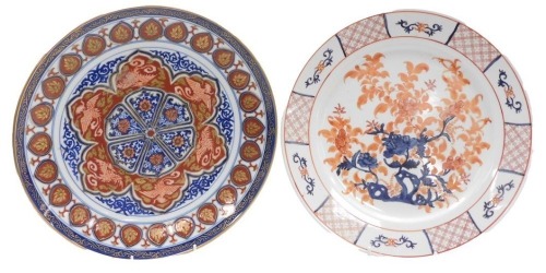Two 20thC Japanese porcelain chargers, one decorated centrally with a flowering tree, the border with repeat reserves, 31cm diameter, the other decorated with a repeating pattern of floral reserves and phoenixes, with outer banding, gilt heightened, stamp