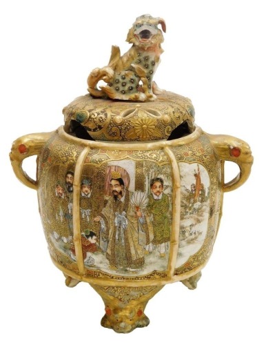 A Meiji period Japanese Satsuma koro, with a dog of fo finial, the base decorated with figures, 22cm high. (AF)