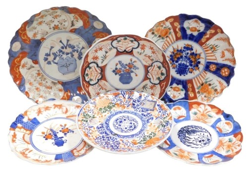 Six Meiji period Japanese Imari porcelain plates, each of scalloped form, variously decorated, some with hand coloured transfer printed designs, the largest 25cm wide.